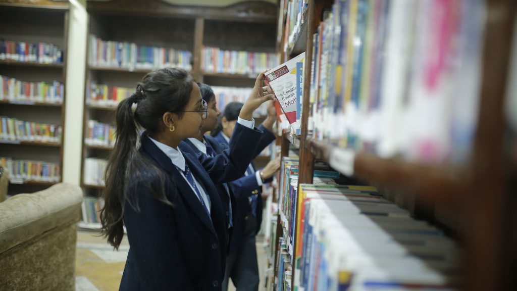 Students search books from Library